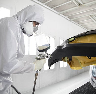 Collision Center Technician Painting a Vehicle | Moses Toyota in St. Albans WV